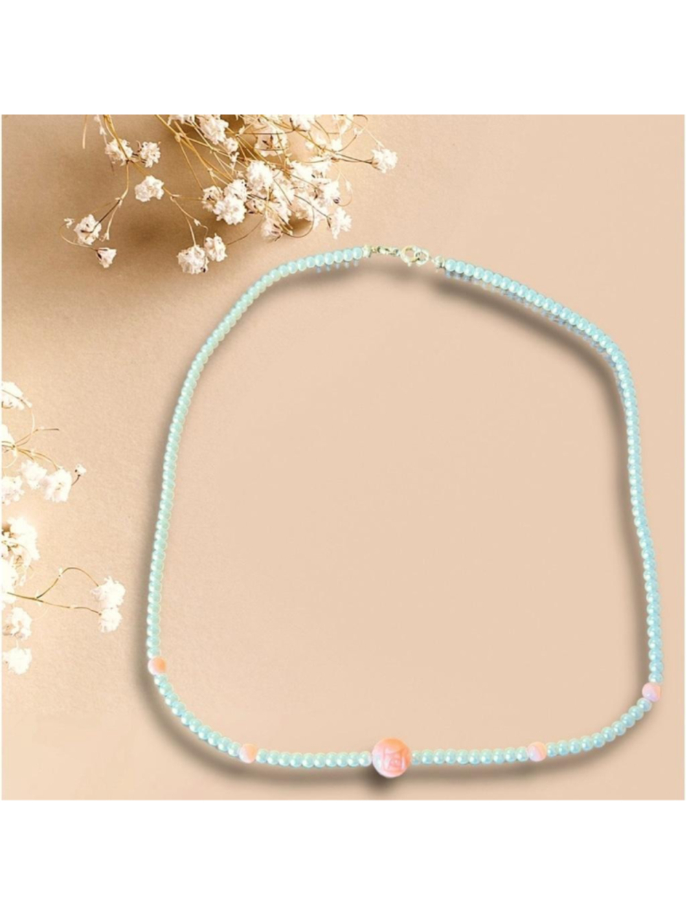 BOHO Faux Pearl necklace with peach accents 17 1/4” long. Central floral bead